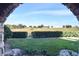 Peaceful pond view from the patio, featuring lush landscaping at 914 Charo Pkwy # 114, Davenport, FL 33897