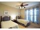 Twin bedroom with two beds and cheerful decor at 914 Charo Pkwy # 114, Davenport, FL 33897