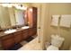 Bathroom with double vanity, granite countertop, and ample storage at 914 Charo Pkwy # 114, Davenport, FL 33897