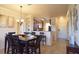 Open concept dining area with a table for six and kitchen access at 914 Charo Pkwy # 114, Davenport, FL 33897