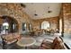Outdoor patio with stone walls, arches and comfortable seating at 914 Charo Pkwy # 114, Davenport, FL 33897