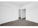 Bedroom with carpet flooring and access to another room at 450 Lake Shore Pkwy, Davenport, FL 33896