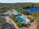 Community pool with a pool house and surrounding landscaping, perfect for relaxation at 450 Lake Shore Pkwy, Davenport, FL 33896