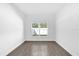 Bright bedroom with tile floors and large window at 450 Lake Shore Pkwy, Davenport, FL 33896