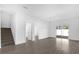 Spacious living area with tile floors and staircase at 450 Lake Shore Pkwy, Davenport, FL 33896