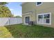 Private backyard with a fenced enclosure at 450 Lake Shore Pkwy, Davenport, FL 33896