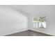 Spacious bedroom with tile floors and large window at 450 Lake Shore Pkwy, Davenport, FL 33896