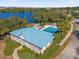 Community pool and recreation area with lake view at 450 Lake Shore Pkwy, Davenport, FL 33896