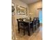 Elegant dining area with a dark wood table and comfortable seating for six at 9033 Rhodes St, Kissimmee, FL 34747