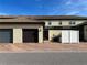 Townhouse exterior with two-car garage and private courtyard at 9033 Rhodes St, Kissimmee, FL 34747