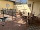 Outdoor patio with dining table, chairs, and lounge chairs next to a pool at 9033 Rhodes St, Kissimmee, FL 34747