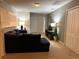 Spacious common area with a sectional sofa and built-in entertainment center at 9033 Rhodes St, Kissimmee, FL 34747