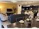 Bright dining area with a large table and access to the living room and kitchen at 9033 Rhodes St, Kissimmee, FL 34747