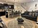 Open living room with kitchen island, seating area, and access to dining area at 9033 Rhodes St, Kissimmee, FL 34747