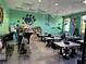 Bright community room with tables and chairs at 9033 Rhodes St, Kissimmee, FL 34747