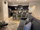 Open concept living area with a kitchen island and seating area at 9033 Rhodes St, Kissimmee, FL 34747