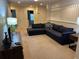 Upstairs den/common area with a sectional sofa and TV at 9033 Rhodes St, Kissimmee, FL 34747