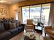 Living room with pool view, comfy seating, and large windows at 9033 Rhodes St, Kissimmee, FL 34747