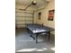 Garage with ping pong table and ample storage space at 9033 Rhodes St, Kissimmee, FL 34747