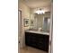 Double vanity bathroom with granite countertop at 9033 Rhodes St, Kissimmee, FL 34747