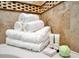 Stack of white towels, bath bombs, and toiletries at 1465 Belle Terre Rd, Davenport, FL 33896