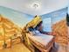 Dinosaur themed bedroom with T-Rex bed at 1465 Belle Terre Rd, Davenport, FL 33896