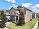 Two-story house with a side view and landscaping at 1465 Belle Terre Rd, Davenport, FL 33896