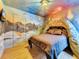 Bedroom with volcano bed and dinosaur mural at 1465 Belle Terre Rd, Davenport, FL 33896