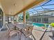 Enjoy dining alfresco near the pool and spa at 1465 Belle Terre Rd, Davenport, FL 33896