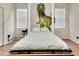 Bedroom featuring a dinosaur mural and a comfortable platform bed at 1465 Belle Terre Rd, Davenport, FL 33896