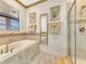 Relaxing bathroom with soaking tub and walk-in shower at 1465 Belle Terre Rd, Davenport, FL 33896