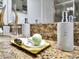 Bathroom vanity with granite countertop, modern fixtures, and bath accessories at 1465 Belle Terre Rd, Davenport, FL 33896