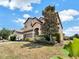 Two story house, view from the side yard at 1465 Belle Terre Rd, Davenport, FL 33896