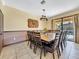 Large dining room with a spacious table and twelve chairs at 1465 Belle Terre Rd, Davenport, FL 33896