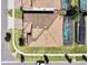 An aerial view of a house with a pool and surrounding landscape at 1465 Belle Terre Rd, Davenport, FL 33896