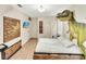 King-size bed in a bedroom with dinosaur mural at 1465 Belle Terre Rd, Davenport, FL 33896