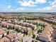 Aerial view of a residential neighborhood showcasing houses and streets at 1465 Belle Terre Rd, Davenport, FL 33896