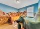 Fun bedroom with dinosaur theme, featuring custom dinosaur beds at 1465 Belle Terre Rd, Davenport, FL 33896