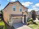 Two story house with a large driveway at 1465 Belle Terre Rd, Davenport, FL 33896