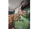 Unique hallway featuring a large dinosaur wall decoration at 1465 Belle Terre Rd, Davenport, FL 33896