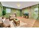 Jungle-themed living room with sofas at 1465 Belle Terre Rd, Davenport, FL 33896