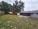 Large backyard with screened porch and shed at 3220 Chariot Pl, Orlando, FL 32818