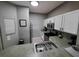 Modern kitchen featuring stainless steel appliances and white cabinets at 904 Park Terrace Cir, Kissimmee, FL 34746