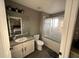 Clean bathroom with a shower/tub combo and white vanity at 904 Park Terrace Cir, Kissimmee, FL 34746