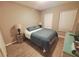Bright bedroom with a double bed and wood-look floors at 904 Park Terrace Cir, Kissimmee, FL 34746