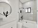 Modern bathroom with marble tile and a soaking tub at 514 Roger Williams Rd, Apopka, FL 32703