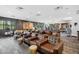 Relaxing community lounge with brown leather chairs and a game area at 5430 Nw 34Th St, Ocala, FL 34482