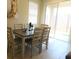Dining area with table and chairs, view to backyard at 5430 Nw 34Th St, Ocala, FL 34482