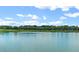 Scenic view of a tranquil lake and clubhouse in the community at 5430 Nw 34Th St, Ocala, FL 34482