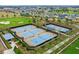 Aerial view of community tennis courts with surrounding landscape at 5430 Nw 34Th St, Ocala, FL 34482